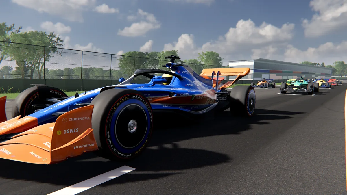 The modern car in front three-quarter view on a sunlit circuit, other cars behind